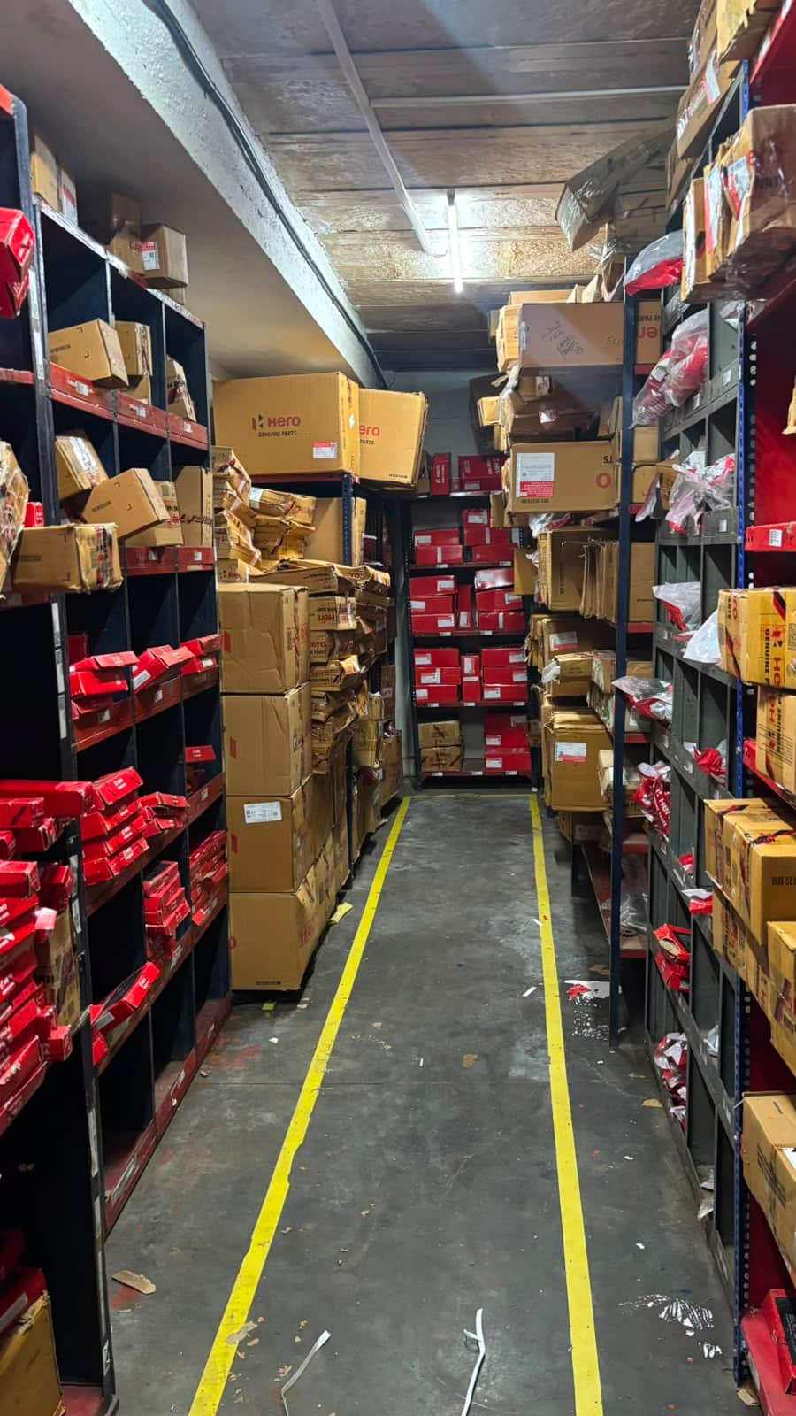 Bulk carton storage aisle of motorcycle spare parts awaiting container consolidation